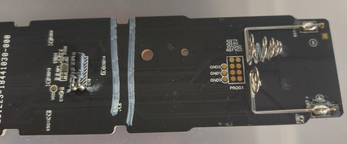 Lower-rear of the TV remote, with programming pads